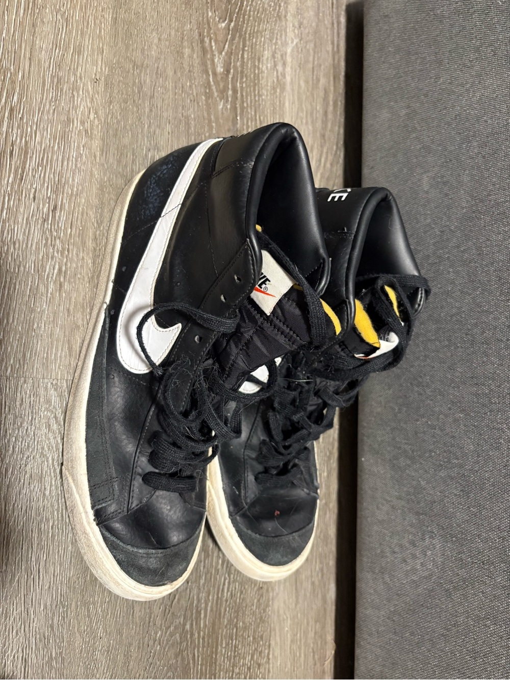 Nike Black and White High-Top Sneakers with Yellow Tongue Detail
